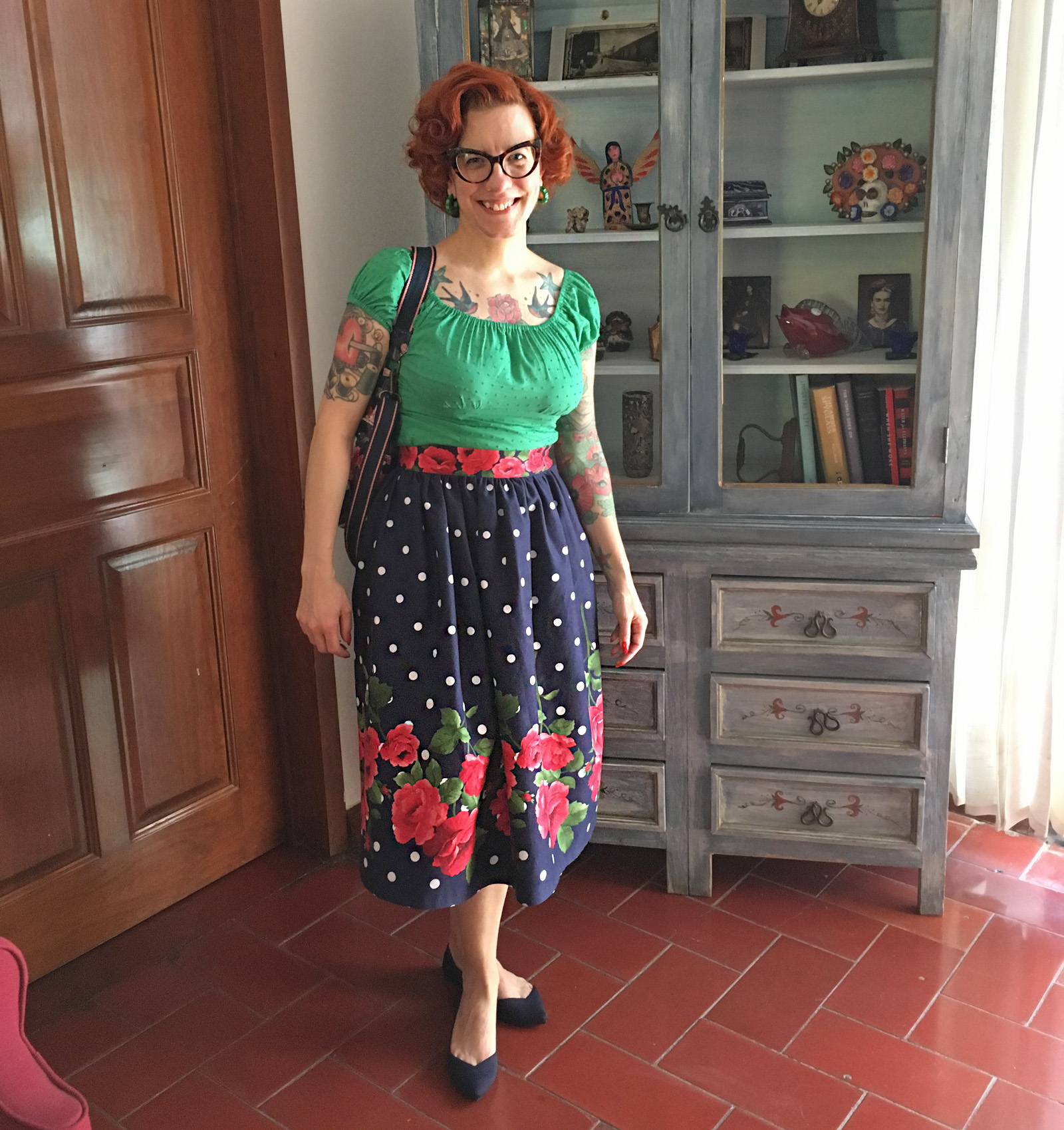 Tasha wearing a polka dot and rose print skirt