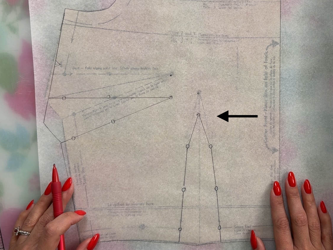 traced waistline dart shown on top of vintage sewing pattern bodice
